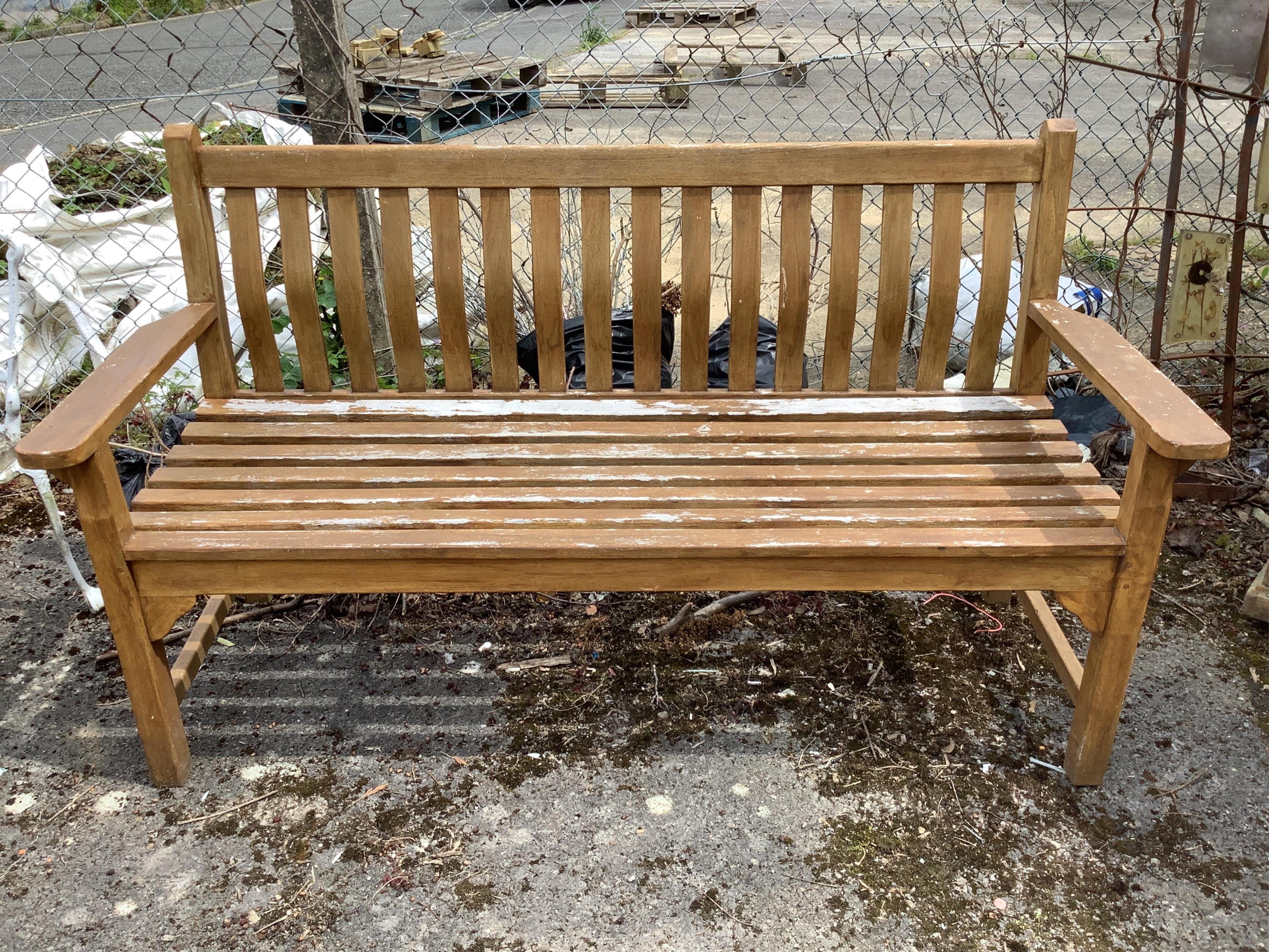 A stained teak slatted garden bench, width 158cm, depth 60cm, height 90cm